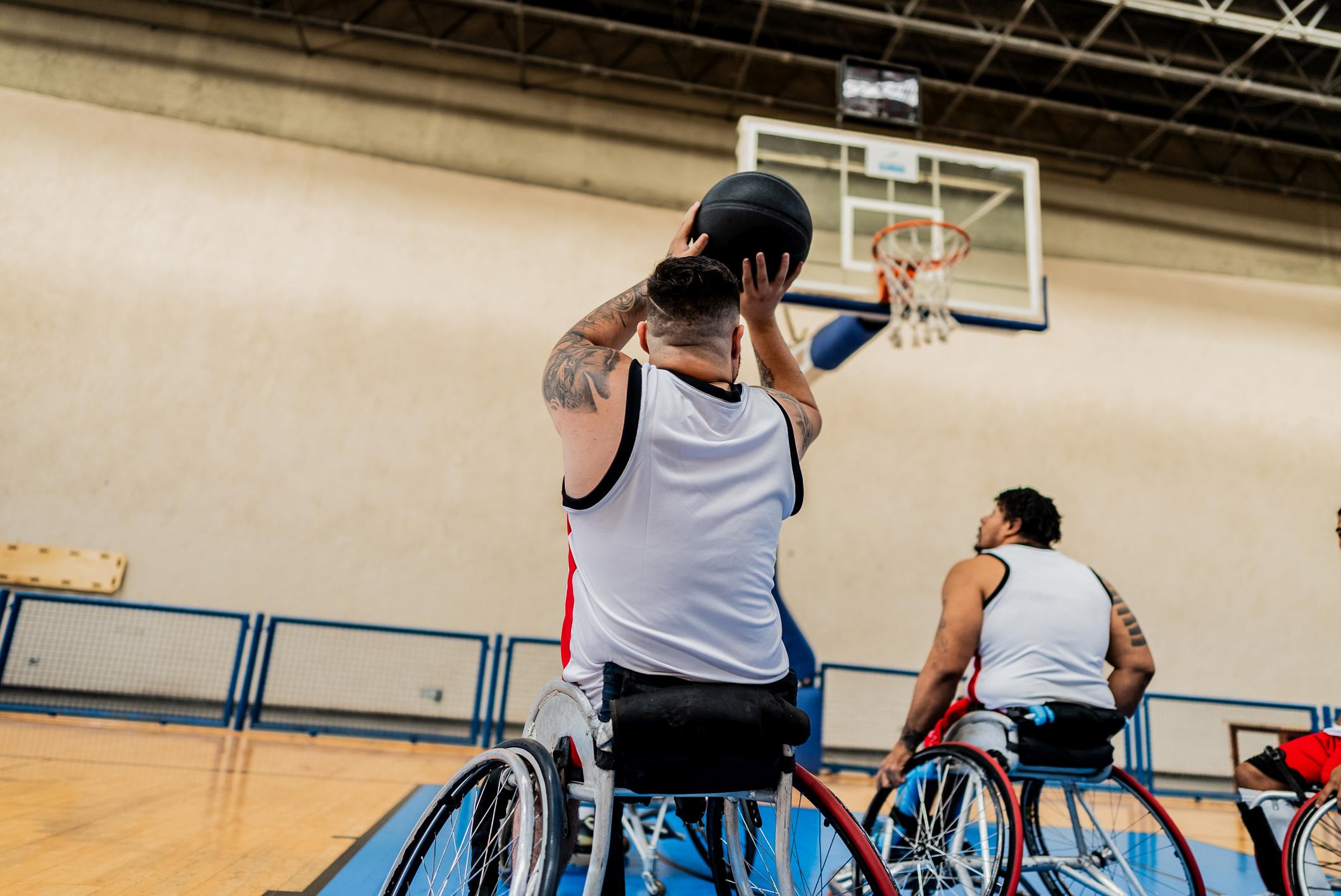 Wheelchair basketball players playing on a sport court