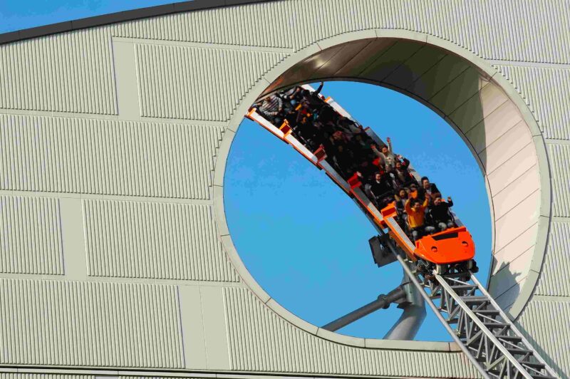 Roller Coaster coming through a hole in a wall