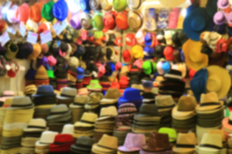 Blurred image of a store full of hats