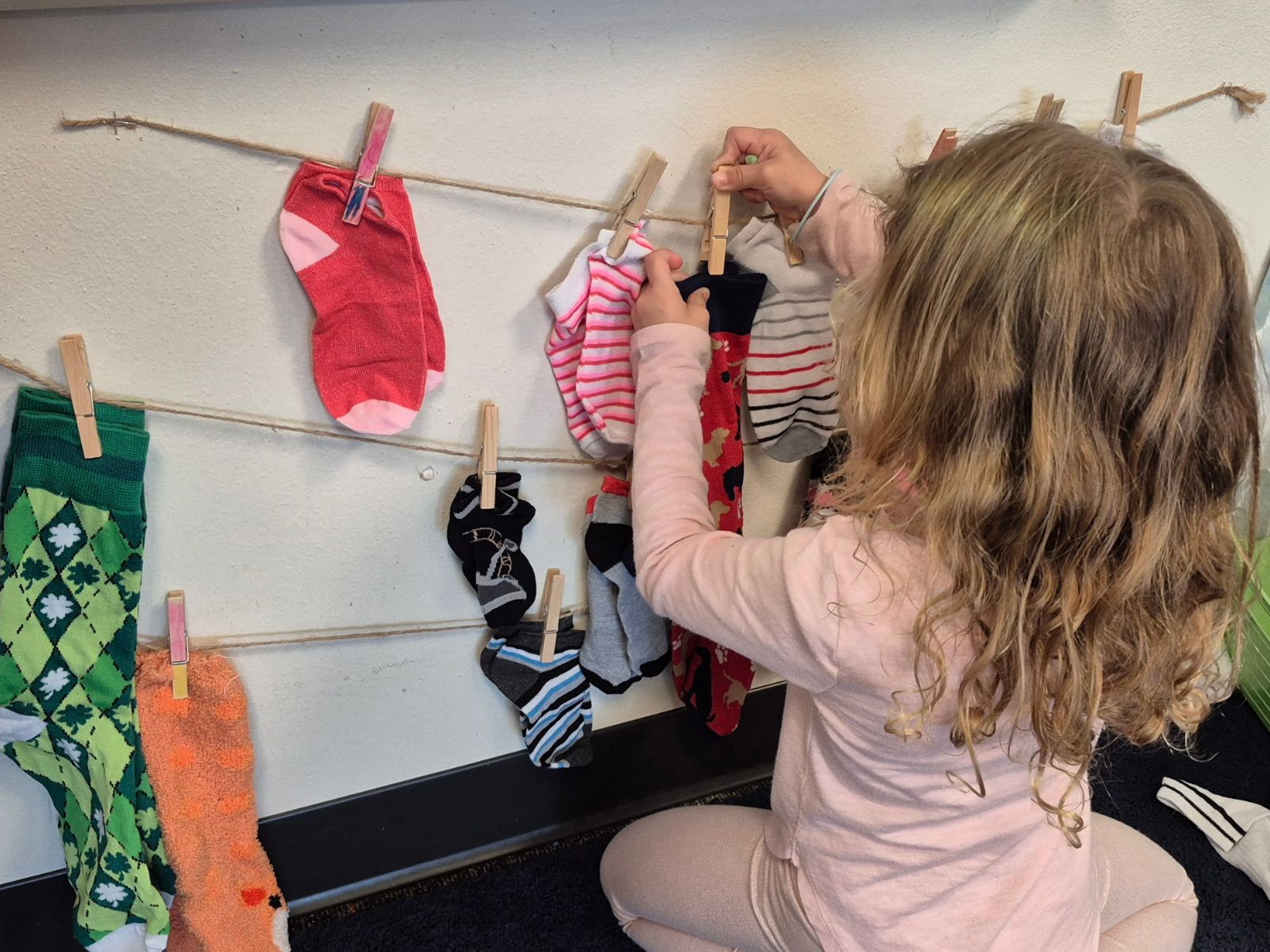 5 Reasons Pre-K Funding Matters Now More Than Ever Little girl matching socks