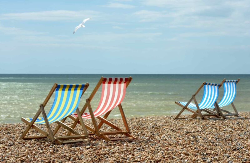 Deck chairs on an English Beach overlooking the English Channel