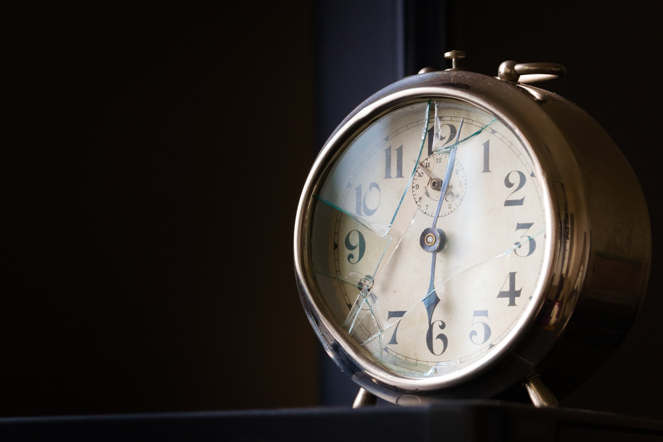 Old, broken mechanical alarm clock. Close up shot with negative space.
