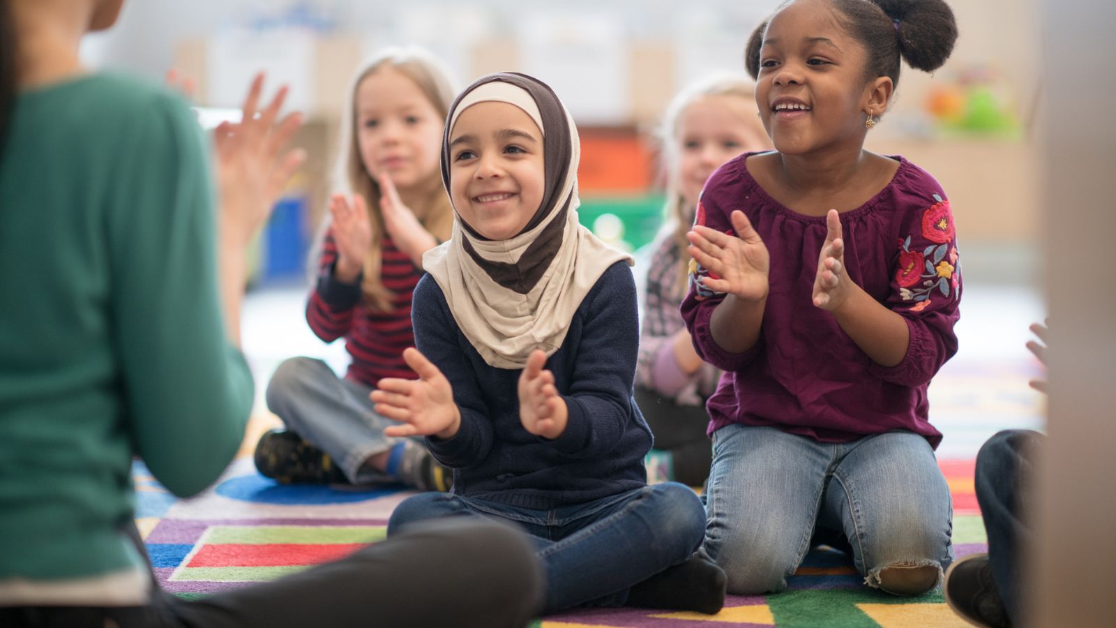 Photo of diverse children in classroom