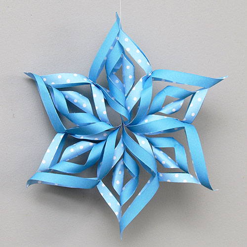 3D Paper Snowflakes 3D Paper snowflake made by cutting, folding, and rolling paper