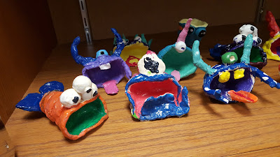 Clay punch pots  turned into big-mouth monsters as a fourth grade art project