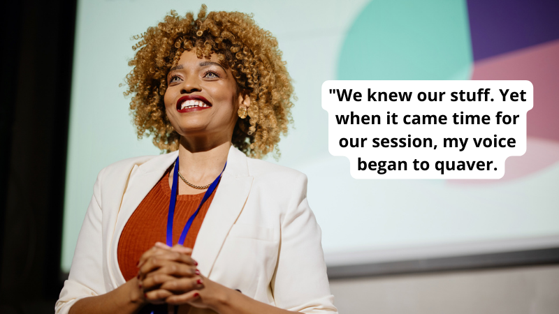 Teacher speaking at education conference with quote